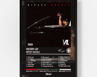 May include: A framed music album poster for Victory Lap by Nipsey Hussle. The poster features a black and white photograph of a person in a car, the tracklist from 1 to 16, a Parental Advisory label, the Victory Lap logo, and release details.