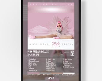 May include: A framed poster of the Nicki Minaj Pink Friday Deluxe Edition album cover. The artwork features a person with pink hair in a white dress, with the text Pink Friday, a tracklist from 1 to 18, and Cash Money Records logo visible.