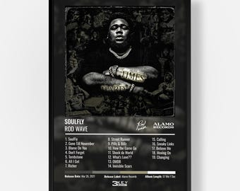 May include: A framed black and white poster of the Rod Wave album Soulfly. The artwork features a central portrait of the artist with the text Hard Times across the arms. Below is a tracklist of 19 songs, the release date March 26, 2021, and label info.