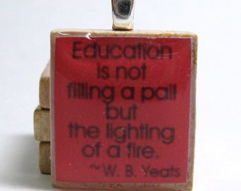 Education is not filling a pail but the lighting of a fire - Yeats quote - red Scrabble tile