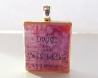 Scrabble tile pendant with Emily Dickinson quote -  Dwell in possibility - pink purple background