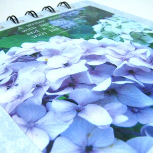 A writer should write with his eyes and a painter paint with his ears - notepad with Gertrude Stein quote and English hydrangeas