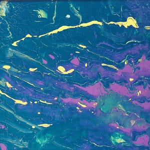 An abstract acrylic pour painting