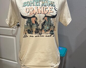 Something in the orange tee