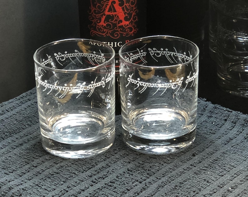 May include: Two clear glass tumblers with the inscription "One Ring to rule them all, One Ring to find them, One Ring to bring them all and in the darkness bind them" etched around the top.