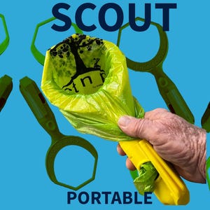 May include: A yellow and green plastic device called "Scout Portable" for picking up dog waste. The device has a green scoop and a yellow handle with a built-in dispenser for dog waste bags. The device is being held by a hand.