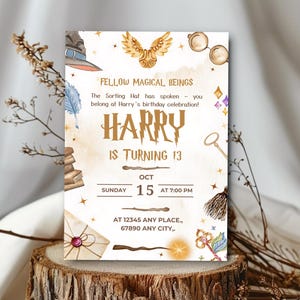 May include: A Harry Potter-themed birthday invitation with watercolor illustrations. The invitation features a sorting hat, golden snitch, glasses, and a wand. Text includes "Fellow Magical Beings" and "Harry is turning 13". The date is October 15th at 7:00 PM.