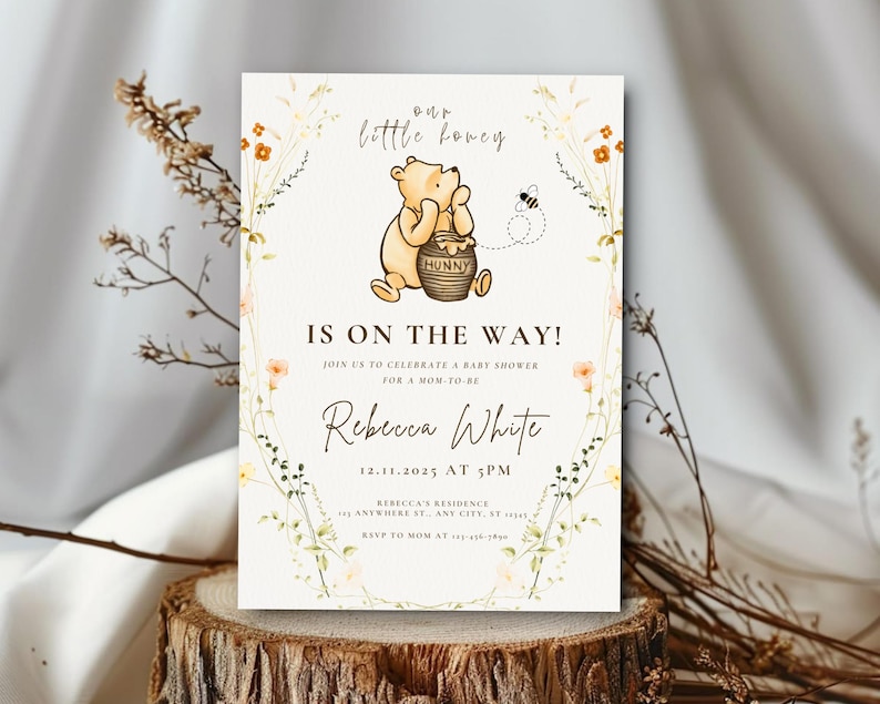 May include: A baby shower invitation with a Winnie the Pooh illustration and the text "Our Little Honey Is On The Way!". The invitation includes details for Rebecca White's baby shower on 12.11.2025 at 5 PM, with floral and bee accents around the edges.