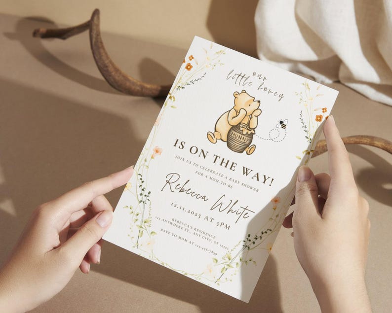 May include: A baby shower invitation with a Winnie the Pooh illustration and the text "Our little honey is on the way!" The invitation includes the name Rebecca White and the date 12.11.2025 at 3 PM. Floral and bee illustrations decorate the edges.