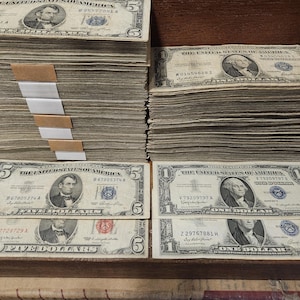 4 US treasury notes.... 1935 and 1957 1 dollar silver cert, 1963 Red Seal and 1953 5 dollar silver certificate