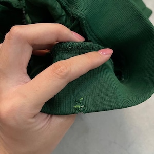 May include: A white ceramic mug with a black handle and the text "But First, Coffee" in a black, bold font. The mug is on a white surface. The mug is 4 inches tall.