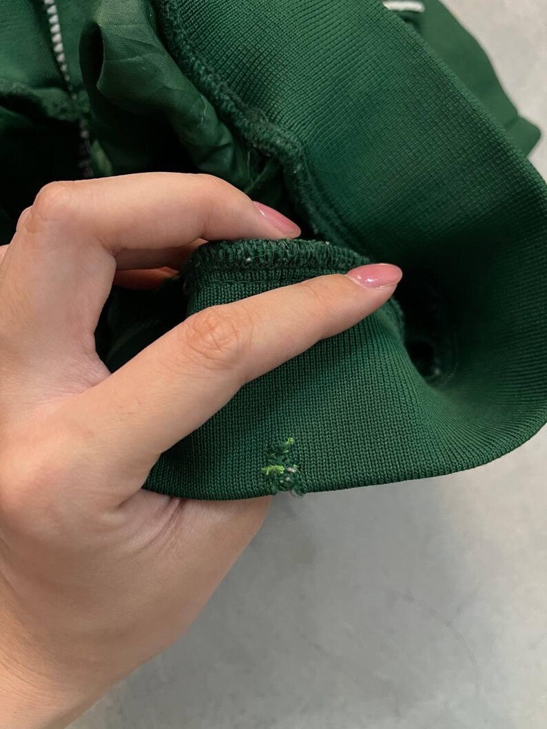 May include: A white ceramic mug with a black handle and the text "But First, Coffee" in a black, bold font. The mug is on a white surface. The mug is 4 inches tall.