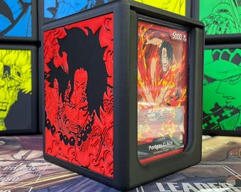 May include: Black deck box with a red and black image of a character from the anime One Piece. The box has a clear window to display a trading card featuring the character "Portgas D. Ace" with the text "Leader 5000".