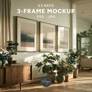 May include: A 4:5 ratio 3-frame mockup PSD JPG featuring three vertical wooden frames hanging on a wall above a wooden cabinet. The frames contain abstract landscape art with muted tones. Several potted green plants sit on the floor.