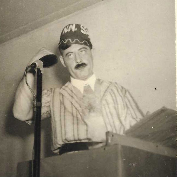 Original Vintage Photo - Small Photo of a Man in Short Sleeved Striped Suit and Brimless Hat (Fraternal Order?) Standing at Podium - 1940s