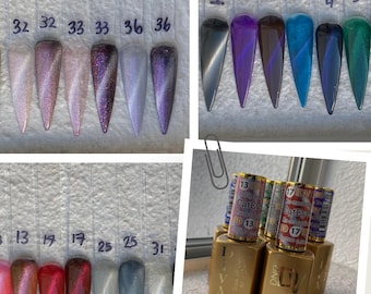 May include: A set of DND Cat Eye gel polish colors in various shades of purple, blue, red, and white. The bottles are labeled with the numbers 13, 17, 25, and 31. The text "DND Cat Eye" is visible on the bottles.