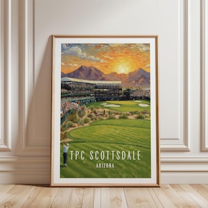 May include: A framed art print depicting a golf course at TPC Scottsdale, Arizona, featuring a golfer on a green fairway, a stadium filled with spectators, distant mountains, and a vibrant orange sunset sky with the text TPC SCOTTSDALE ARIZONA.