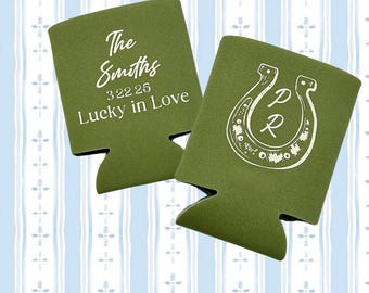 May include: Two green can coolers with white text and designs. One cooler says "The Smiths 322 25 Lucky in Love". The other cooler has a horseshoe with the letters "P" and "R" inside.