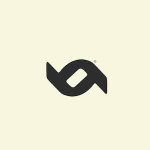 May include: A black logo on a cream background. The logo is a stylized, abstract design composed of two mirrored shapes, with a central, elongated oval. A small registered trademark symbol is in the upper right corner.