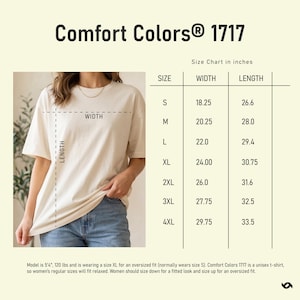 May include: Cream-colored Comfort Colors 1717 t-shirt with a size chart in inches. The chart lists sizes S to 4XL, with corresponding width and length measurements. The model is wearing an XL for an oversized fit. The shirt is unisex.