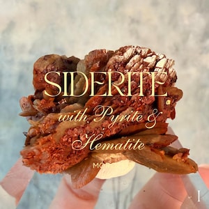 May include: A close-up of a mineral specimen featuring a cluster of reddish-brown siderite crystals with pyrite and hematite inclusions. The text "SIDERITE with Pyrite & Hematite" is overlaid on the image.