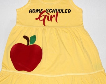 yellow dress with red apples