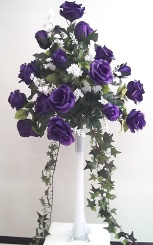 Romantic, dramatic flower arrangements - lots of roses in Eiffel tower vases  spray painted mat…