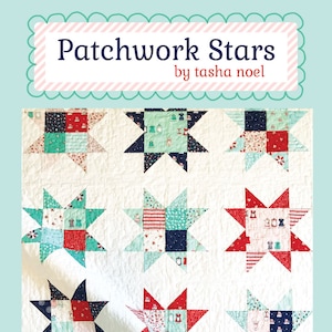 May include: A patchwork quilt with a repeating star pattern in red, teal, and navy blue. The quilt features the text "Patchwork Stars by tasha noel" in a decorative frame. The quilt is on a white background.