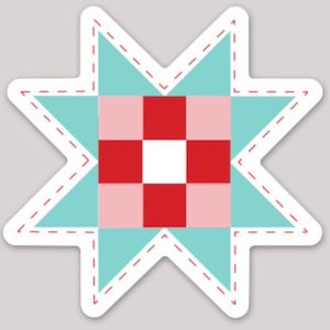 May include: A star-shaped sticker featuring a quilt block design. The star has a light blue background with a white border and red dashed stitching. The center of the star has a red, pink, and white checkered pattern.