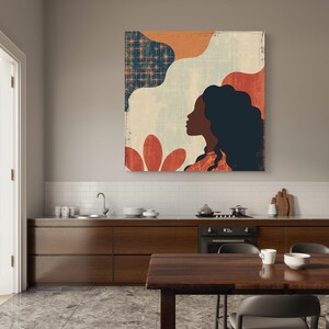 May include: Abstract art print featuring a woman's silhouette with long dark hair against a background of geometric shapes in shades of orange, blue, and white.