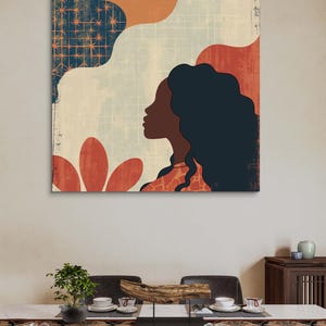 May include: Abstract art print featuring a woman's profile with long dark hair, set against a background of geometric shapes in shades of blue, orange, and red.