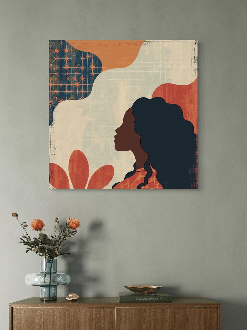 May include: Abstract art print featuring a woman's silhouette with long dark hair, a red flower, and geometric shapes in shades of orange, blue, and white.
