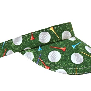 On The Green - White Golf Balls & Tees on Green Grass SUN Golf Visor - Cotton Print Ladies Womens Sports Fashion Hat by Calico Caps®