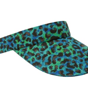 May include: A blue and green visor with a leopard print pattern.