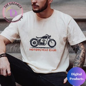 May include: A white t-shirt with a vintage motorcycle graphic and the text "Motorcycle Club" in red and blue.