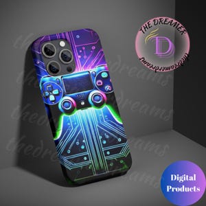 May include: A black phone case with a neon blue, green, and purple design of a video game controller on a circuit board. The text "THE DREAMER" is in a pink circle with a white letter D in the center.
