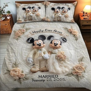 May include: A cream-colored bedding set featuring Mickey and Minnie Mouse in wedding attire. The quilt has a circular design with the words "Happily Ever After" and "Married February 28, 2025." Two matching pillowcases with Mickey and Minnie are also included.