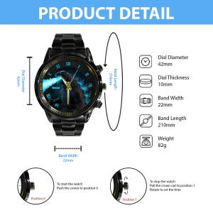 K&ouml;nnte beinhalten: Schwarze Armbanduhr mit Godzilla-Grafik auf dem Zifferblatt. Die Uhr hat einen Zifferblattdurchmesser von 42 mm, eine Bandbreite von 22 mm und eine Bandl&auml;nge von 210 mm. Die Uhr wiegt 82 g.