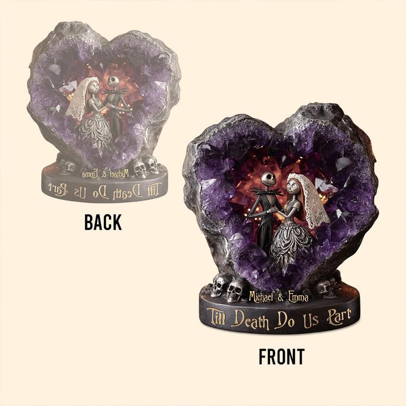 May include: A decorative heart-shaped sculpture with a purple crystal interior, featuring Jack and Sally from The Nightmare Before Christmas. The base reads "Till Death Do Us Part" and includes the names "Michael & Emma". Skulls are at the base.
