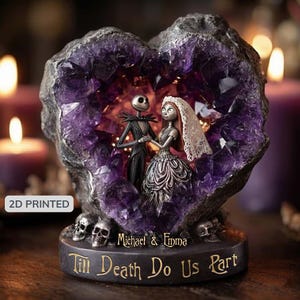 May include: A heart-shaped amethyst geode sculpture featuring Jack and Sally from The Nightmare Before Christmas. The base reads "Till Death Do Us Part" with the names "Michael & Emma" above. Skulls are at the base. The sculpture is 2D printed.