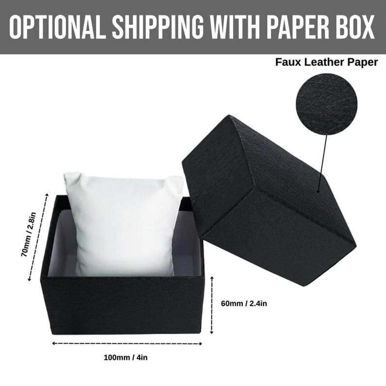 May include: Black watch box with a white pillow inside. The box is open, revealing the interior. The dimensions are 4 inches long, 2.4 inches wide, and 2.8 inches high. The text "Faux Leather Paper" is visible.