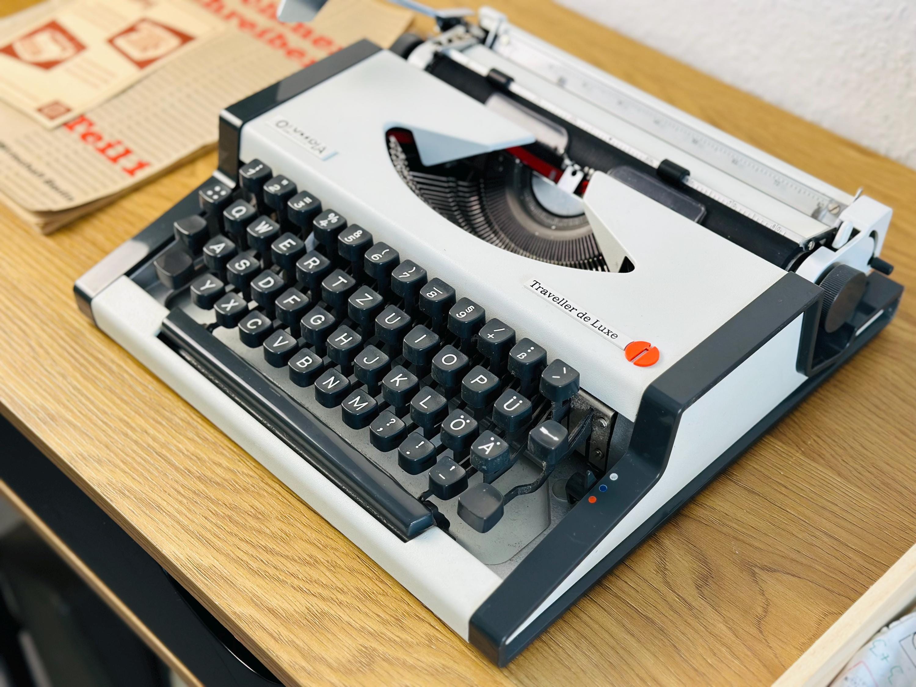 オリンピア トラベラー デ リュクス：ホワイト ヴィンテージ