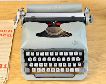 Vintage Torpedo Typewriter: Gray German Manual Machine, 1950s Decor
