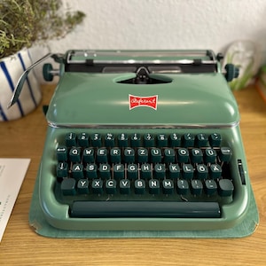 Vintage referent typemachine 1960 - smaragdgroen - gemaakt in Duitsland - uitstekende staat met originele garantiekaart en accessoires