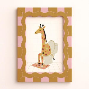 May include: A framed print featuring a giraffe sitting on a toilet. The giraffe has a yellow body with brown and pink spots. The frame is gold with a pink and gold checkered border. The giraffe is sitting on a white toilet with a pink and brown patterned rug.