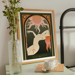 Celestial Sun Goddess Art Print featuring radiant sun beams, divine feminine energy, and tarot symbolism. Mystical boho spiritual decor perfect for astrology lovers, meditation rooms, and sacred spaces. This tarot inspired feminine poster embodies enlightenment, empowerment, and cosmic intuition with warm vintage tones. Ideal for bedroom or living room wall art, witchy decor, and spiritual home inspiration.