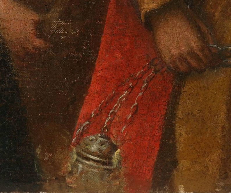May include: A close-up of a painting depicting a person wearing a red robe and holding a chain attached to a metal object. The chain is silver and the object is brown.