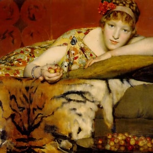 May include: A woman in a yellow and red patterned dress reclines on a couch with a tiger skin throw. She holds a small bowl of cherries in her hand.