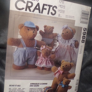 May include: McCall's Crafts pattern envelope featuring a family of teddy bears. The bears are dressed in various outfits, including overalls, dresses, and bows. The pattern includes instructions for 11-inch and 19-inch bears.