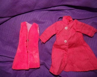 May include: A pink corduroy vest and a pink corduroy coat with button closures.